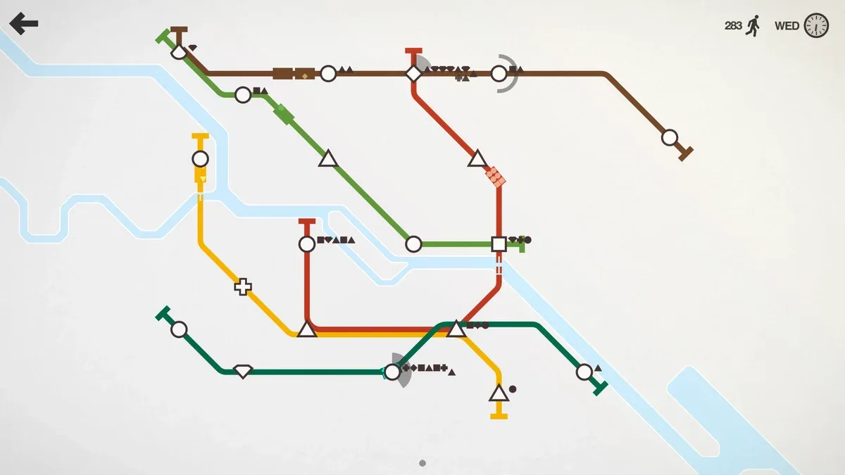 Mini Metro network with triangle passengers waiting on a brown line that connects to a red line at a diamond station
