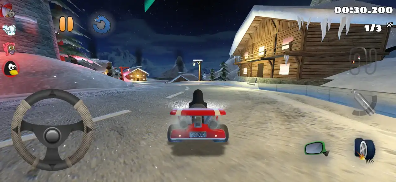 Tux driving through a snowy SuperTuxKart village at night with the Android touch controls visible