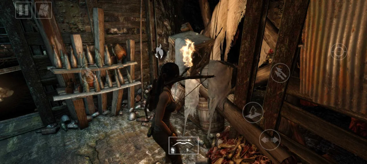 Lara Croft aims her bow inside a wooden shelter with mobile controls visible